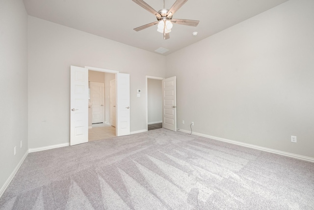 unfurnished bedroom with ceiling fan and light carpet