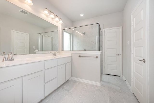 bathroom featuring vanity and walk in shower