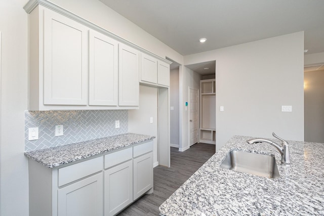 212 Painted Trl, Forney, TX 75126 - kitchen featuring wood finished floors, light stone counters, tasteful backsplash, and recessed lighting