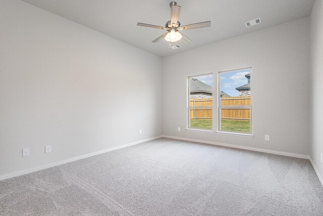 carpeted empty room with ceiling fan