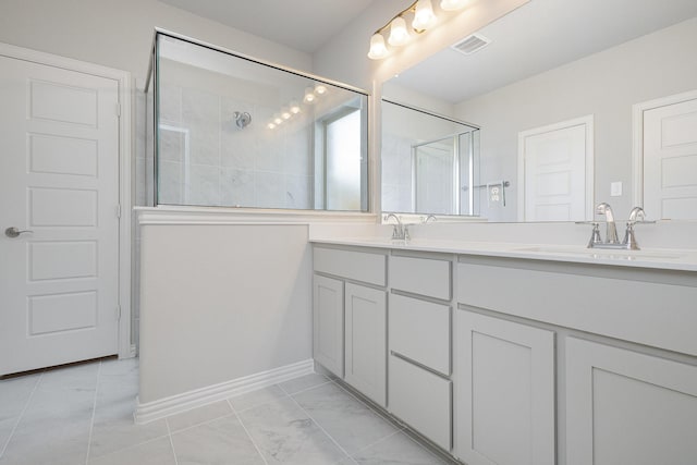 bathroom with vanity and an enclosed shower