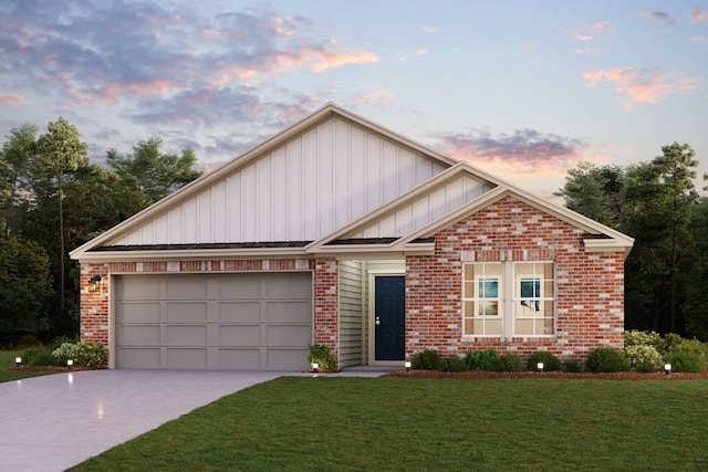 view of front of home featuring a lawn and a garage