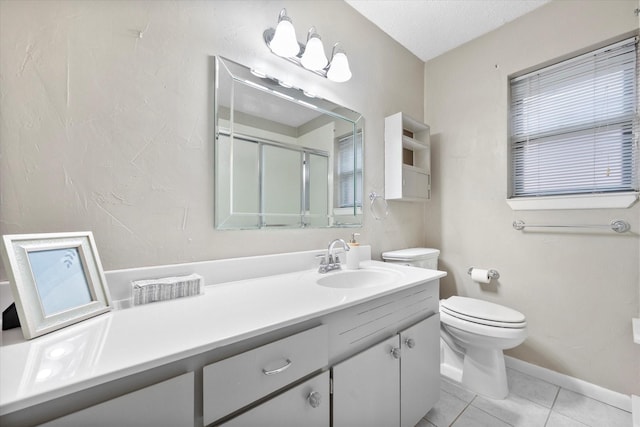 bathroom featuring vanity, toilet, a shower with door, tile patterned floors, and a textured ceiling