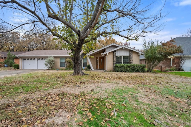 ranch-style home featuring a garage