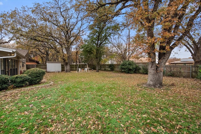 view of yard with a storage unit