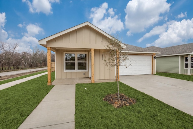 ranch-style home with a garage and a front yard