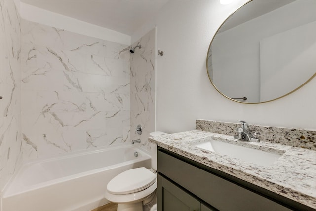 full bathroom featuring vanity, toilet, and tiled shower / bath