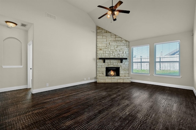 unfurnished living room with a stone fireplace, dark hardwood / wood-style floors, high vaulted ceiling, and ceiling fan