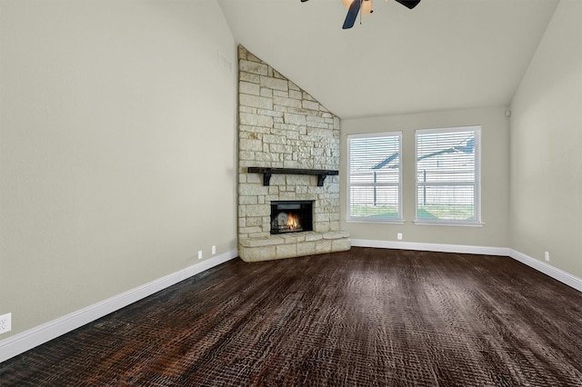 unfurnished living room featuring ceiling fan, a stone fireplace, and high vaulted ceiling