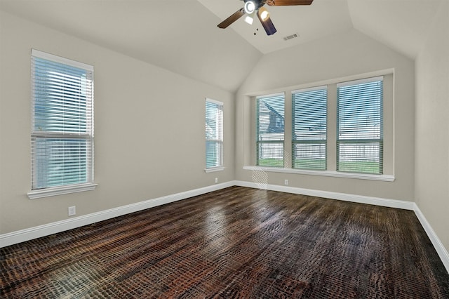 empty room featuring ceiling fan and vaulted ceiling