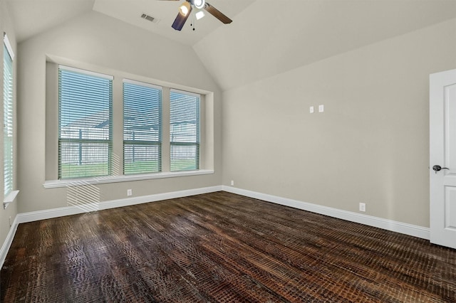 spare room with ceiling fan, lofted ceiling, and dark hardwood / wood-style flooring