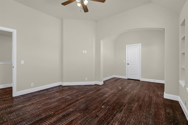 unfurnished room featuring lofted ceiling, dark wood-type flooring, and ceiling fan