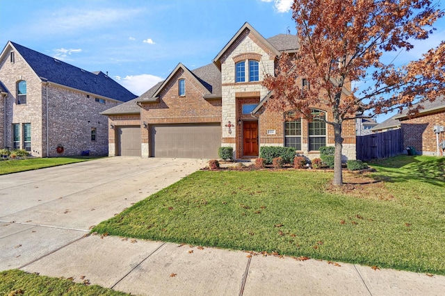 view of front of house with a garage and a front lawn