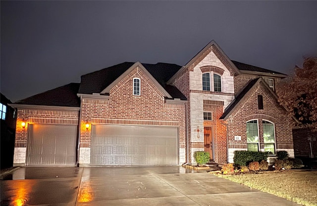 view of front of home with a garage