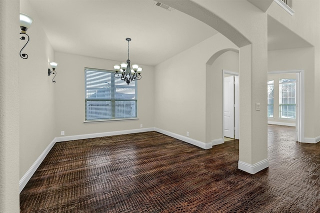 unfurnished dining area with a chandelier