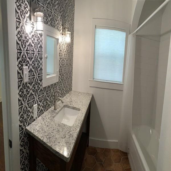 bathroom with vanity, tile patterned floors, and shower / bath combo with shower curtain