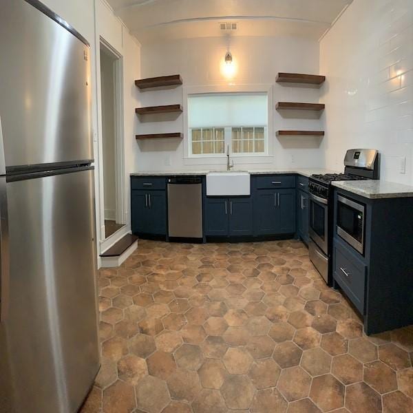 kitchen featuring appliances with stainless steel finishes and sink