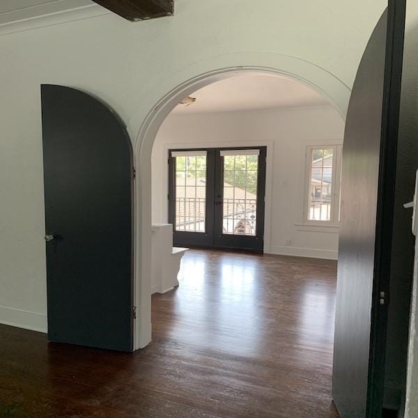 entryway featuring dark hardwood / wood-style floors and french doors