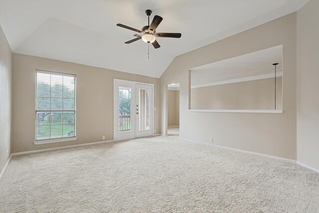 carpeted empty room featuring ceiling fan and lofted ceiling