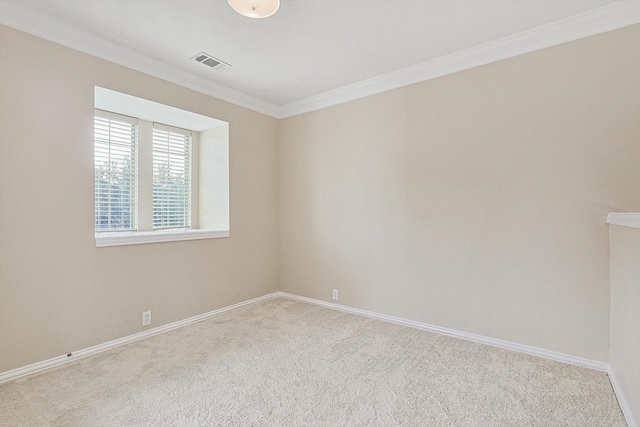 carpeted spare room featuring ornamental molding