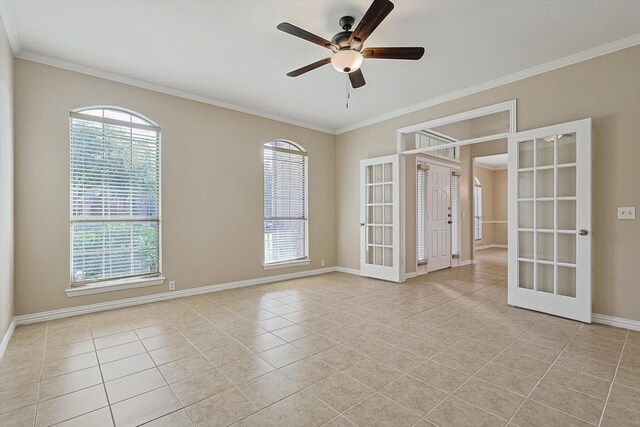 tiled spare room with ceiling fan, french doors, and plenty of natural light