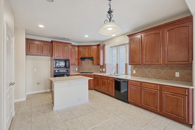 kitchen featuring tasteful backsplash, sink, black appliances, pendant lighting, and a kitchen island