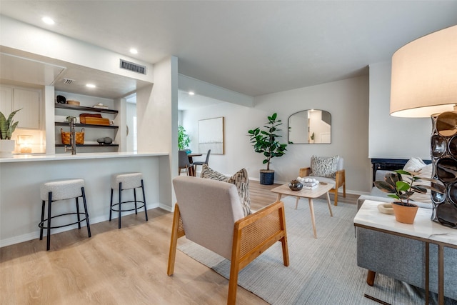 living room with light hardwood / wood-style floors