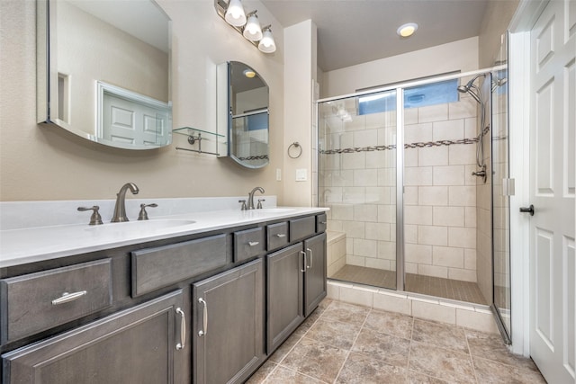 bathroom featuring vanity and a shower with door