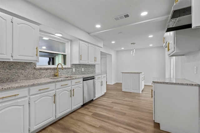 kitchen with sink, light hardwood / wood-style flooring, dishwasher, white cabinets, and hanging light fixtures