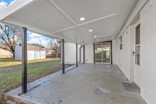 view of patio / terrace featuring a storage shed