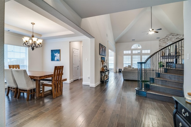 dining room featuring ceiling fan with notable chandelier and dark hardwood / wood-style floors