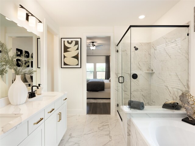 bathroom featuring vanity, separate shower and tub, and ceiling fan