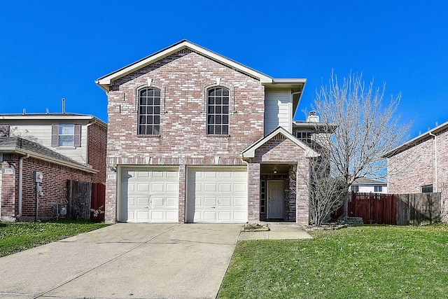 view of property featuring a garage and a front lawn