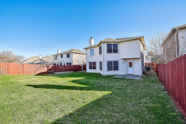 back of property featuring a yard and a patio area