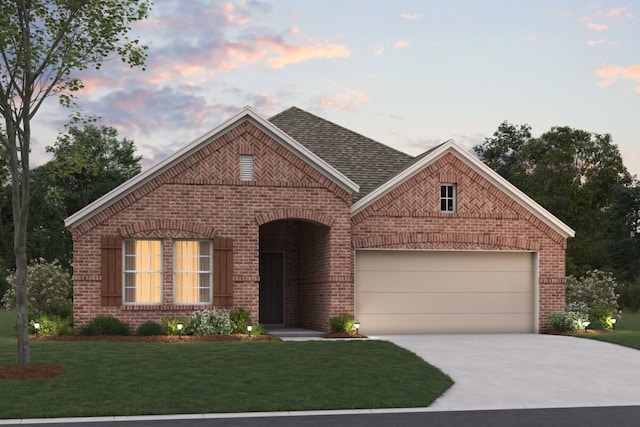 view of front of property featuring a lawn and a garage