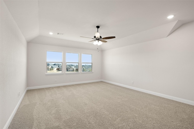 empty room with baseboards, a ceiling fan, recessed lighting, and light colored carpet