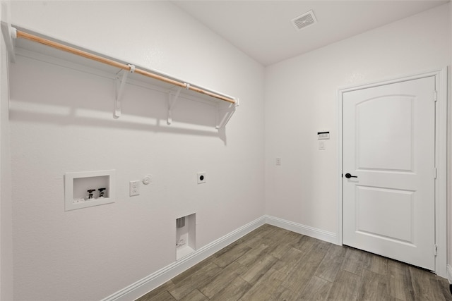 laundry area with visible vents, laundry area, wood finished floors, electric dryer hookup, and washer hookup