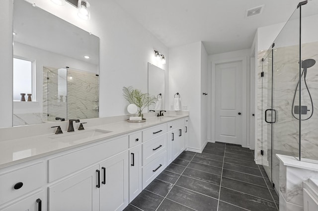 bathroom featuring vanity and an enclosed shower