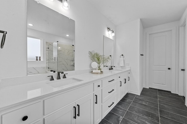 bathroom with vanity and a shower with shower door