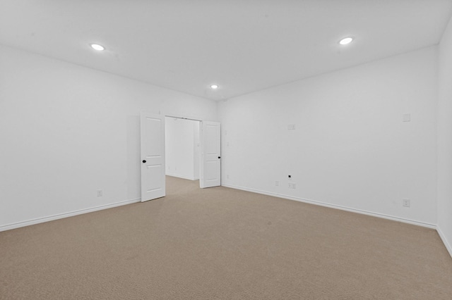 spare room with light carpet