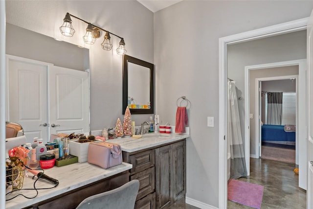 bathroom featuring vanity and concrete floors