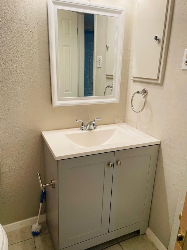 bathroom featuring tile patterned floors and vanity