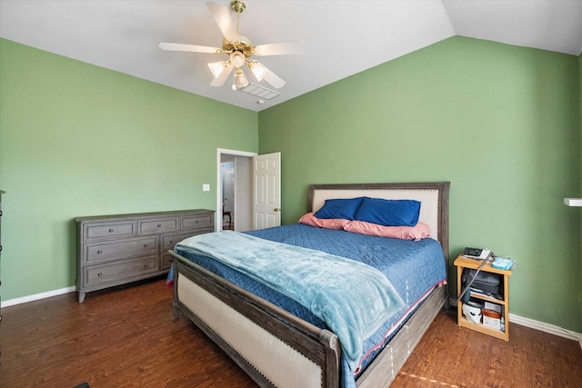 bedroom with ceiling fan, dark hardwood / wood-style floors, and lofted ceiling