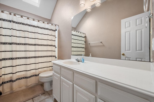 bathroom featuring a shower with shower curtain, vanity, tile patterned flooring, and toilet