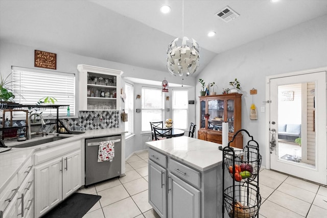 kitchen featuring stainless steel dishwasher, plenty of natural light, and sink