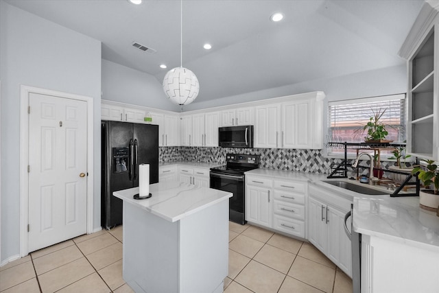 kitchen featuring sink, white cabinetry, a kitchen island, decorative light fixtures, and black appliances