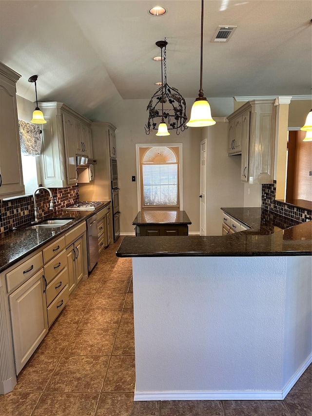 kitchen with gray cabinets, hanging light fixtures, and sink