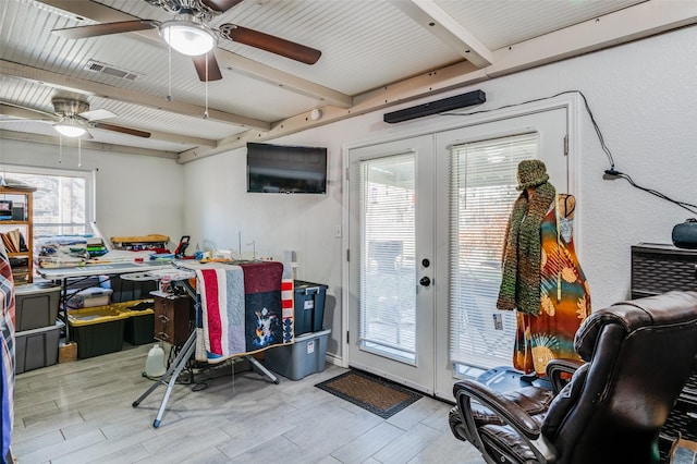 interior space with ceiling fan, french doors, and light hardwood / wood-style flooring