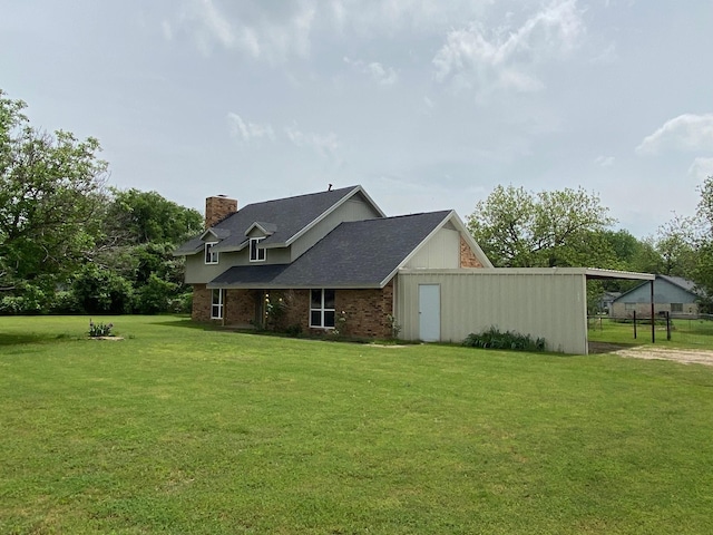 view of side of property with a yard