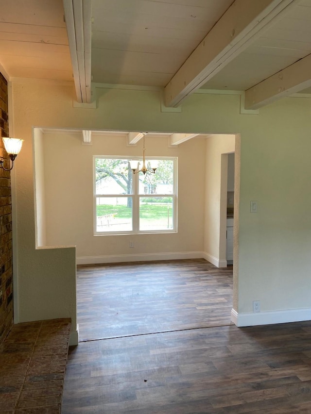 empty room featuring a notable chandelier, beam ceiling, wooden ceiling, and dark wood-type flooring